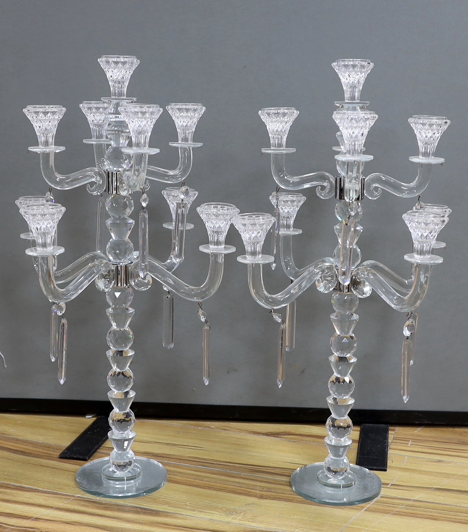 A pair of modern eight branch, nine light lustre candelabra, 63cm high